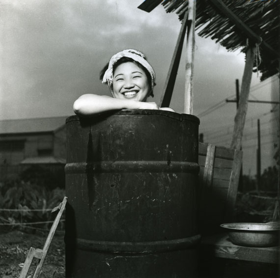 © Rikko Nakamura. Taking a bath in a oil drum, Togoshi, Shinagawa?ku. Modern print. 1946